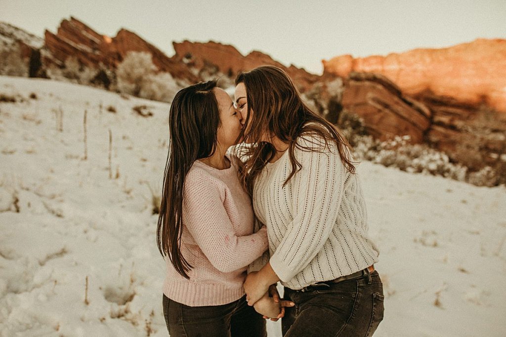 Gay Denver Couple kissing on Valentine's Day at Red Rocks Amphitheater