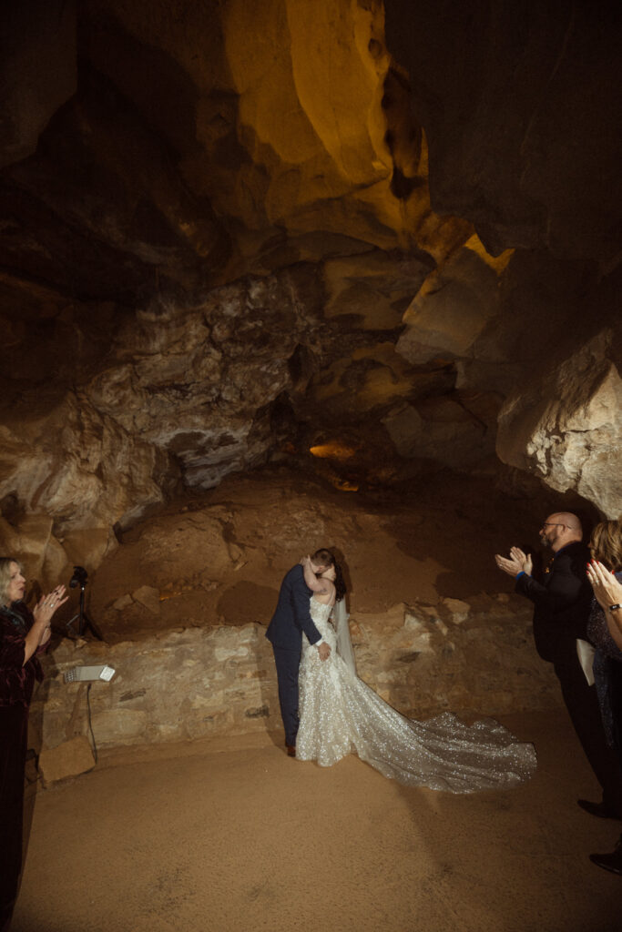 A couple getting married in the Cave of the Winds in Colorado through self solemnization