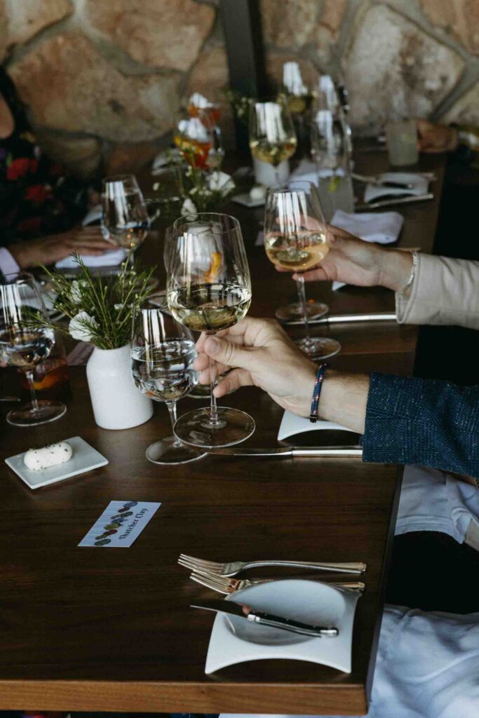 Newly-weds toast with their friends and family at their intimate wedding in Colorado