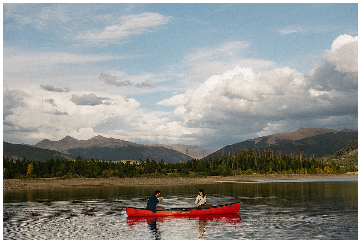 A candid mountain engagement session photographed for a newly engaged couple.