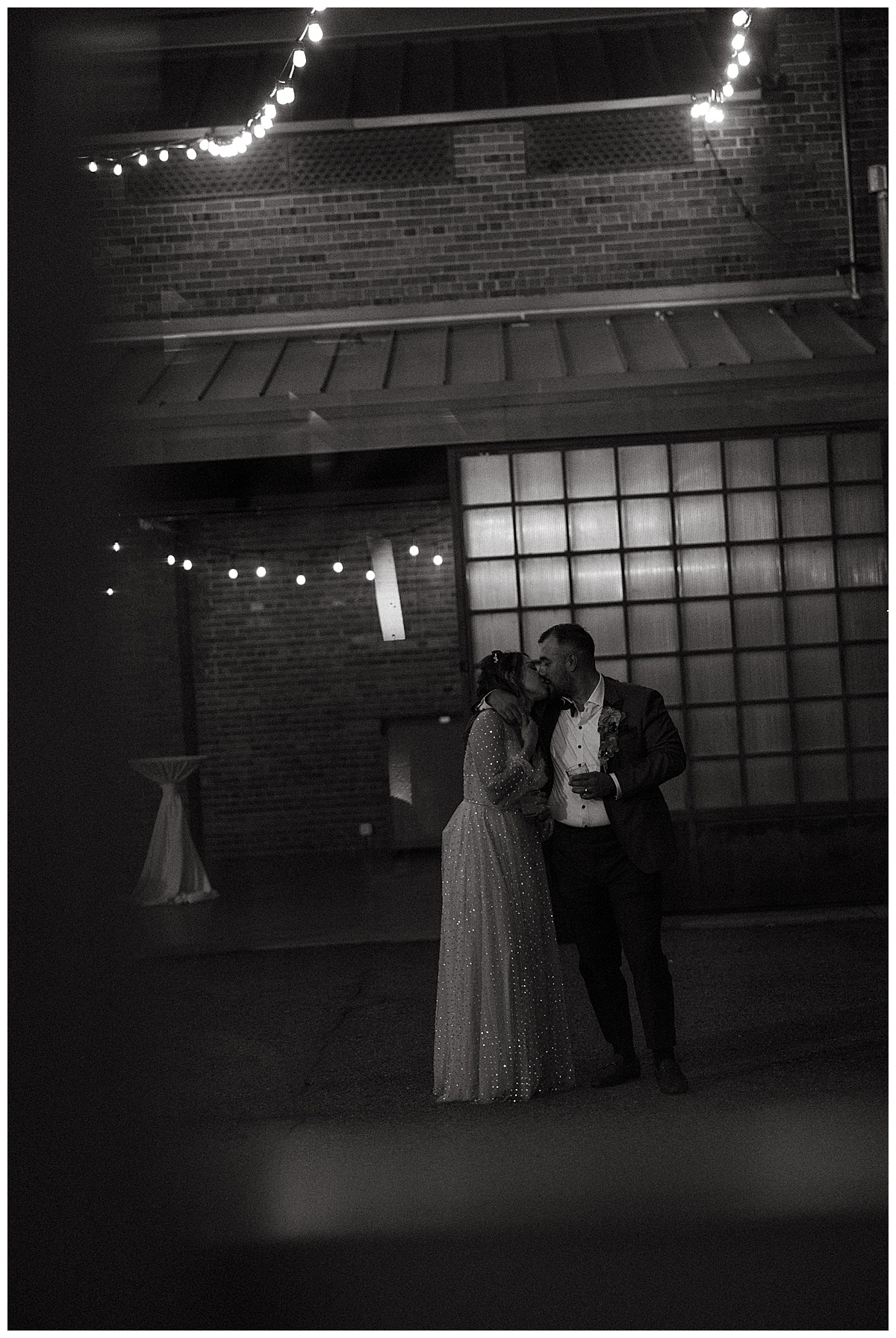 A couple shares an intimate moment during their wedding at Blanc Denver.