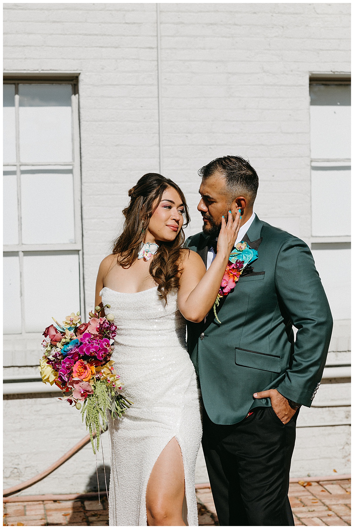 This couple poses for a photo during their wedding at Blanc Denver.